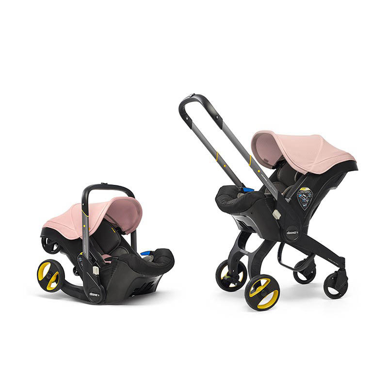 silla de coche convertible doona de simple parenting en el color blush pink