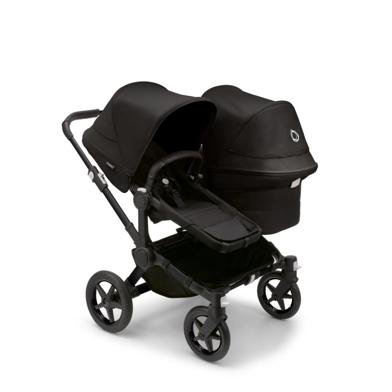 Bugaboo donkey 5 duo, con chasis negro, funda negra y capota en negro medianoche.