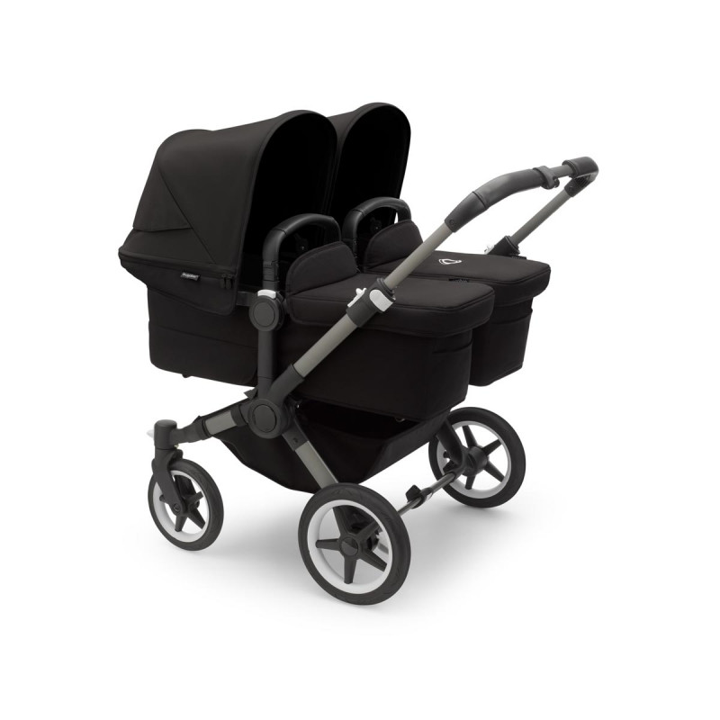 Cochecito Bugaboo donkey 5 twin, con chasis grafito, funda negra y capota en negro medianoche.