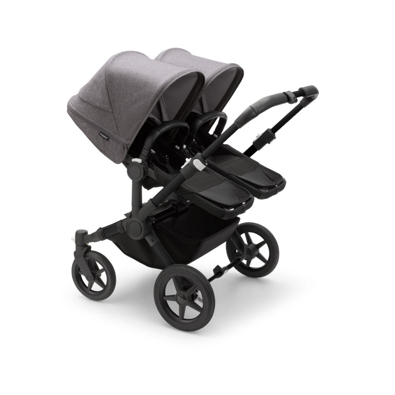 Silla de paseo Bugaboo donkey 5 twin, con chasis negro, funda negra y capota en gris melange.