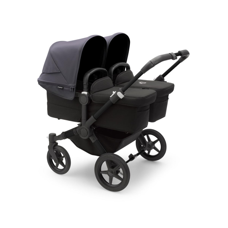 Cochecito Bugaboo donkey 5 twin, con chasis negro, funda negra y capota en azul tormenta.