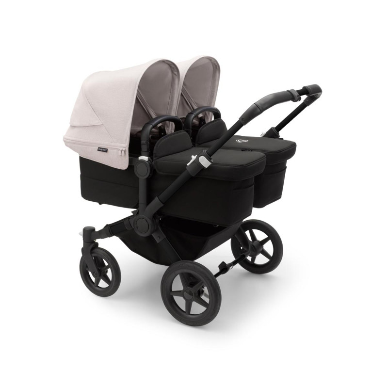 Cochecito Bugaboo donkey 5 twin, con chasis negro, funda negra y capota en blanco niebla.