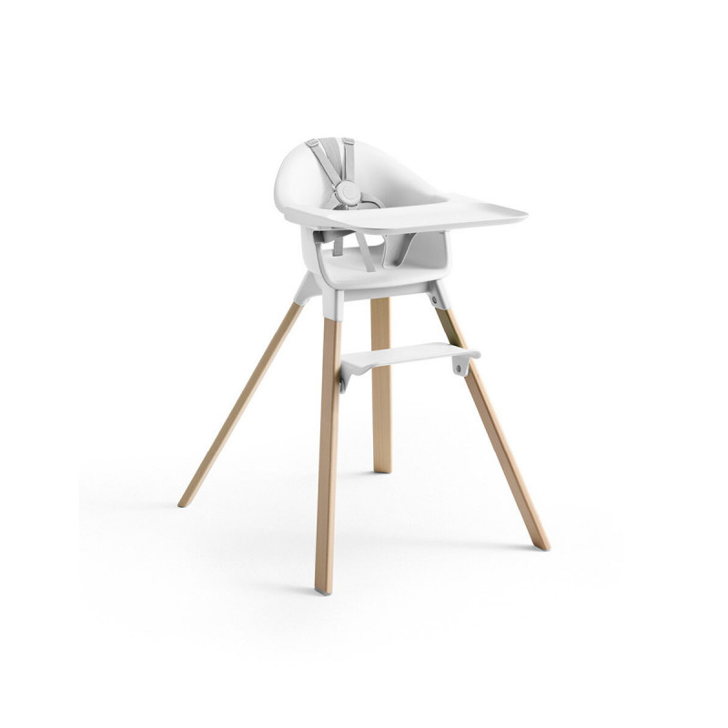 Trona Clikk de Stokke en color blanco y patas de madera de haya. Incluye bandeja y arnés.