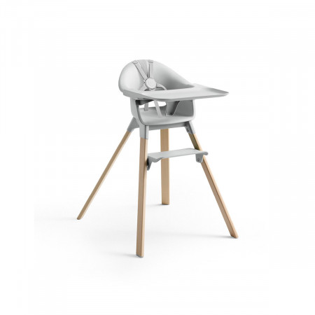 Trona Clikk de Stokke en color gris y patas de madera de haya. Incluye bandeja y arnés.
