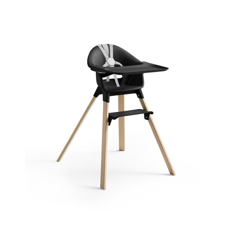 Trona Clikk de Stokke en color negro y patas de madera de haya. Incluye bandeja y arnés.