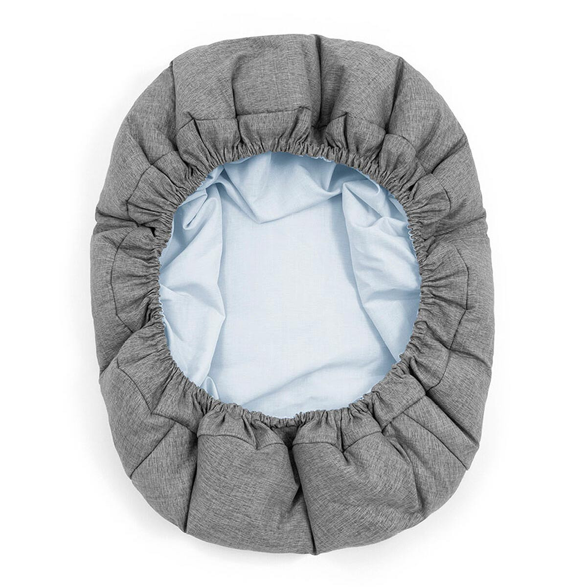 Newborn set para trona Nomi de Stokke, con textil reversible y lavable en color gris, por un lado, y azul, por el otro.