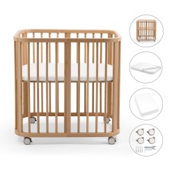 pack de la minicuna Stokke Nighti MINI que incluye cuna, colchón, sábana bajera y ruedas